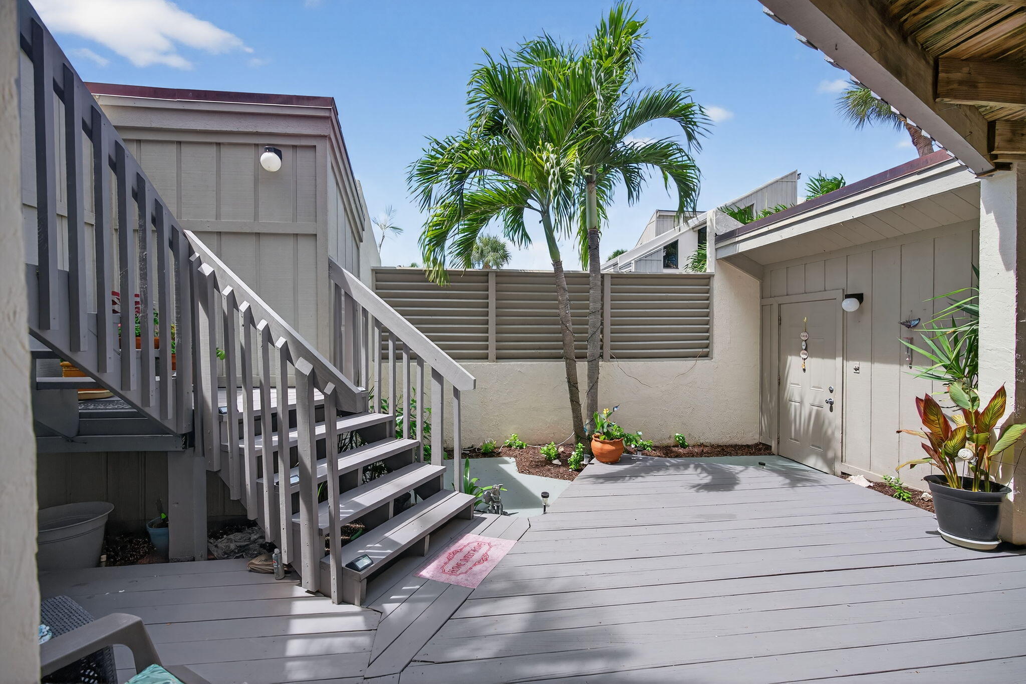 1605 Highway 1, Unit 8E Jupiter, FL 33477 - Photo 26 of 47 a view of entryway and hall with wooden floor