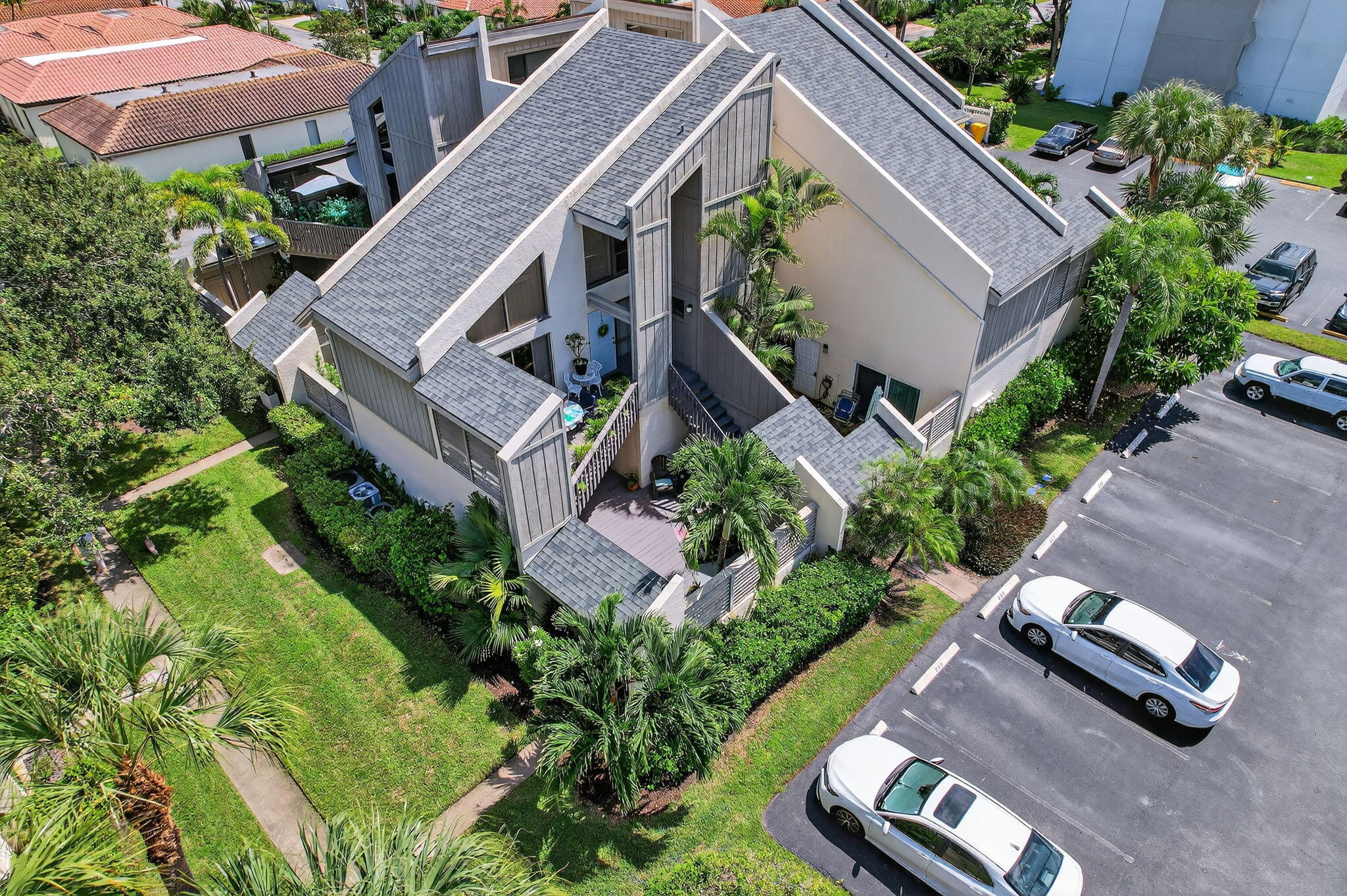 1605 Highway 1, Unit 8E Jupiter, FL 33477 - Photo 28 of 47 an aerial view of a house with garden space and street view