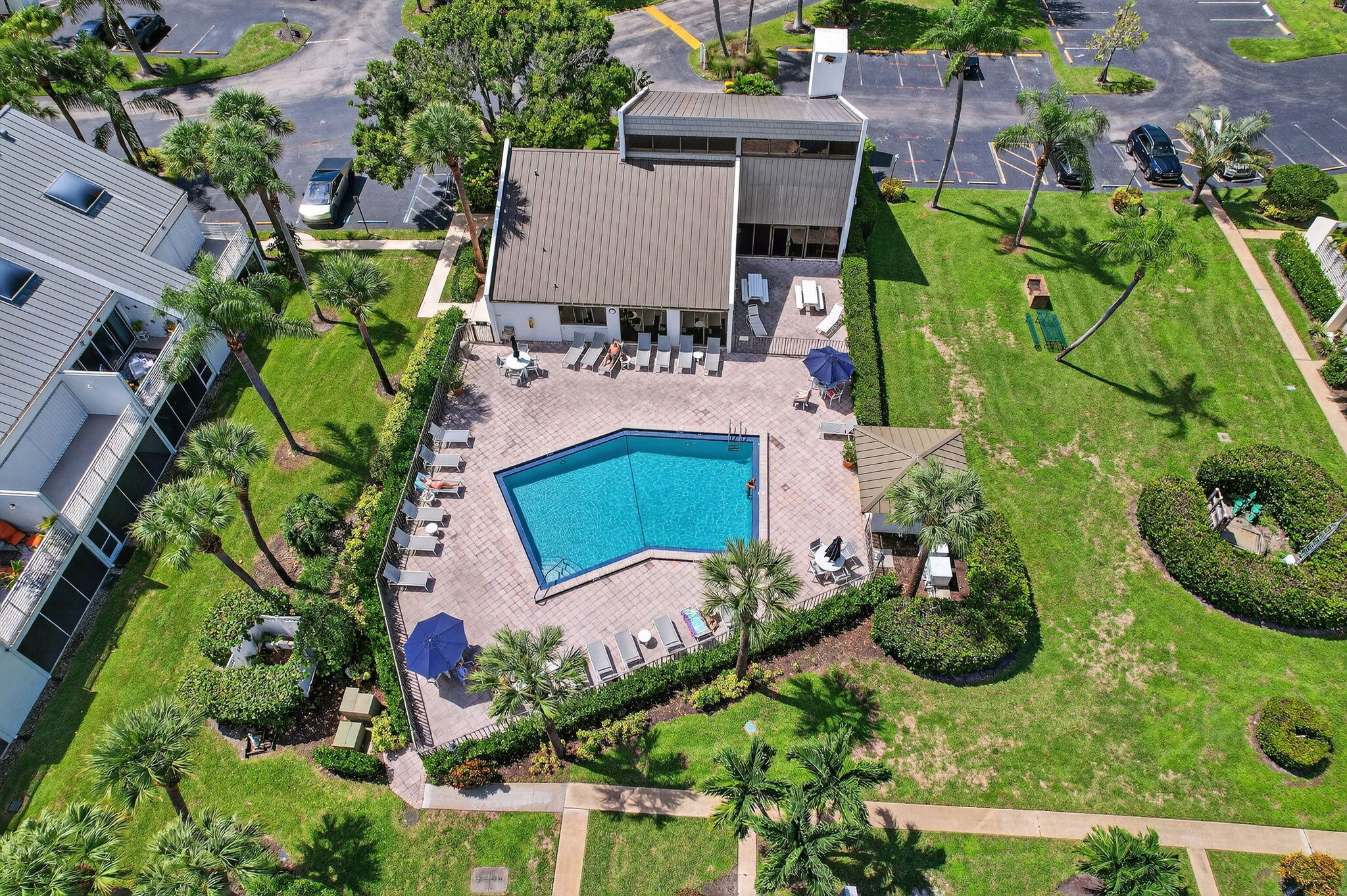 1605 Highway 1, Unit 8E Jupiter, FL 33477 - Photo 30 of 47 an aerial view of a house with a garden and swimming pool