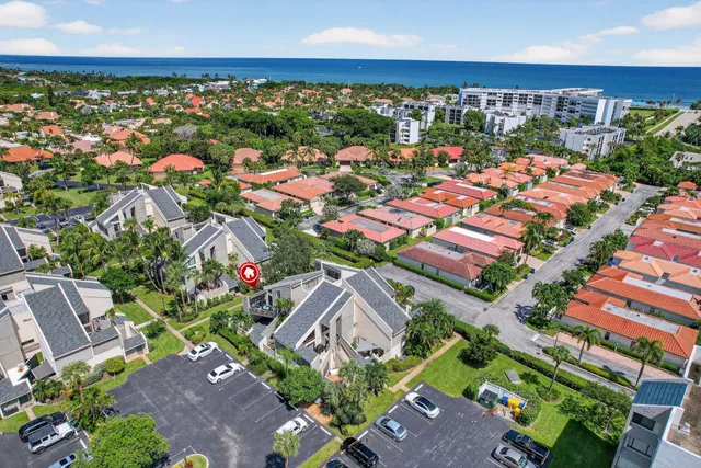 an aerial view of residential houses with outdoor space and street view