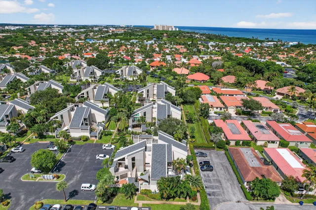 an aerial view of residential houses with outdoor space