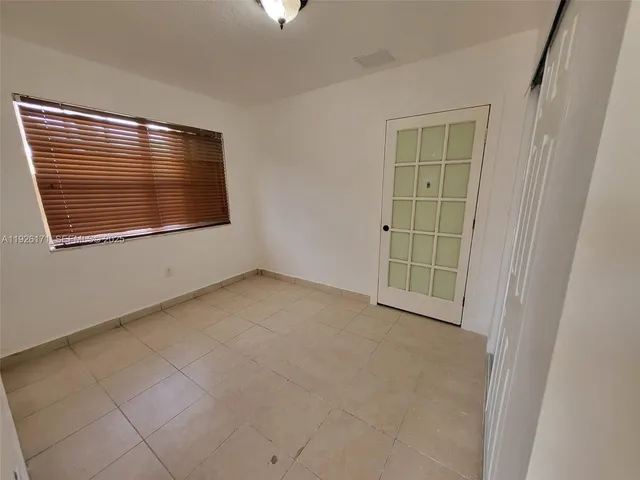 a view of an empty room and entryway