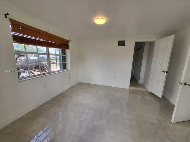 a view of outdoor space with wooden fence