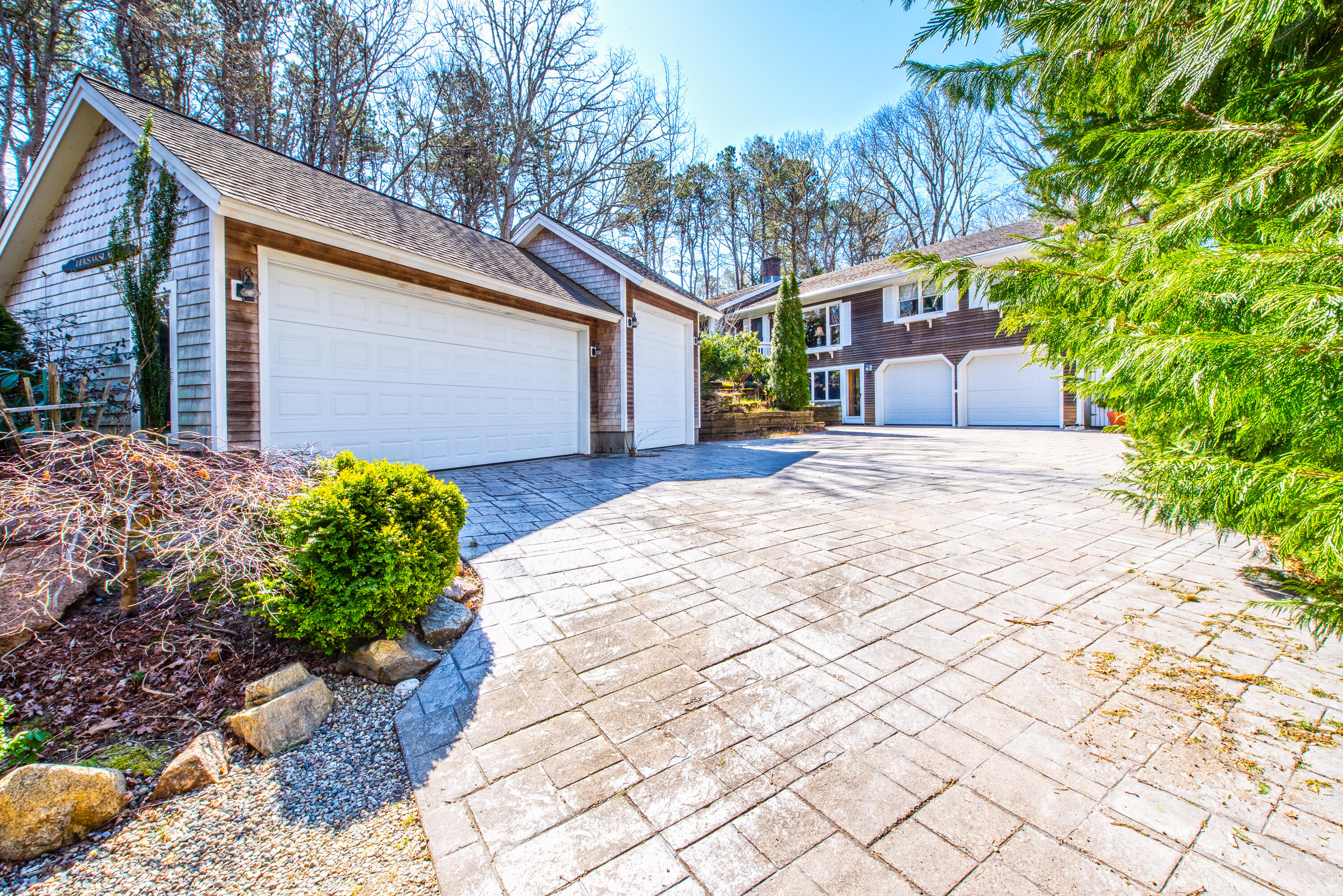 95 Herring River Road Wellfleet, MA 02667 - Photo 3 of 37 a front view of a house with garden