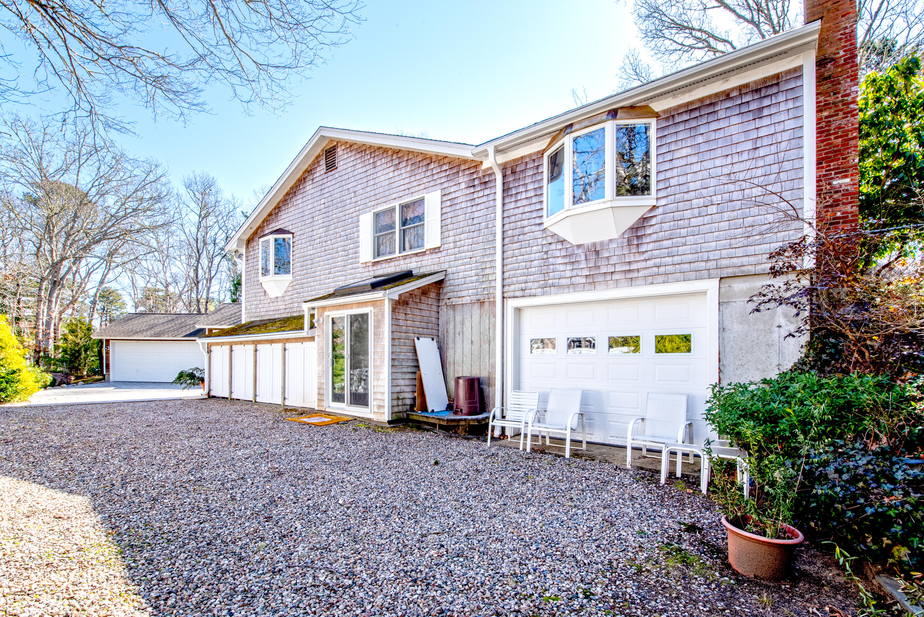95 Herring River Road Wellfleet, MA 02667 - Photo 6 of 37 a front view of a house with garden
