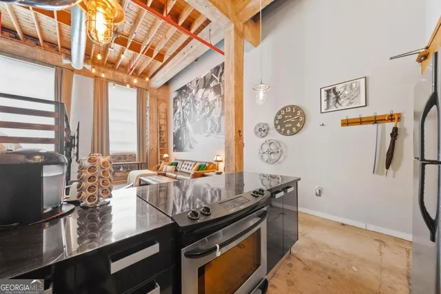 a kitchen with a sink and refrigerator