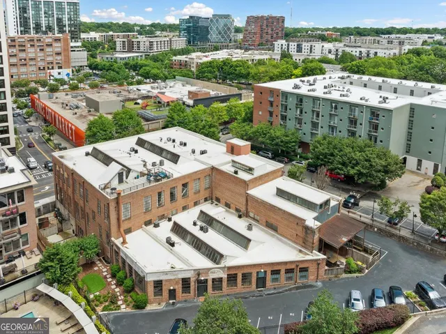 a view of a brick house with a outdoor space
