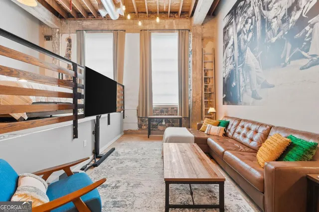 a bedroom with bed and a window