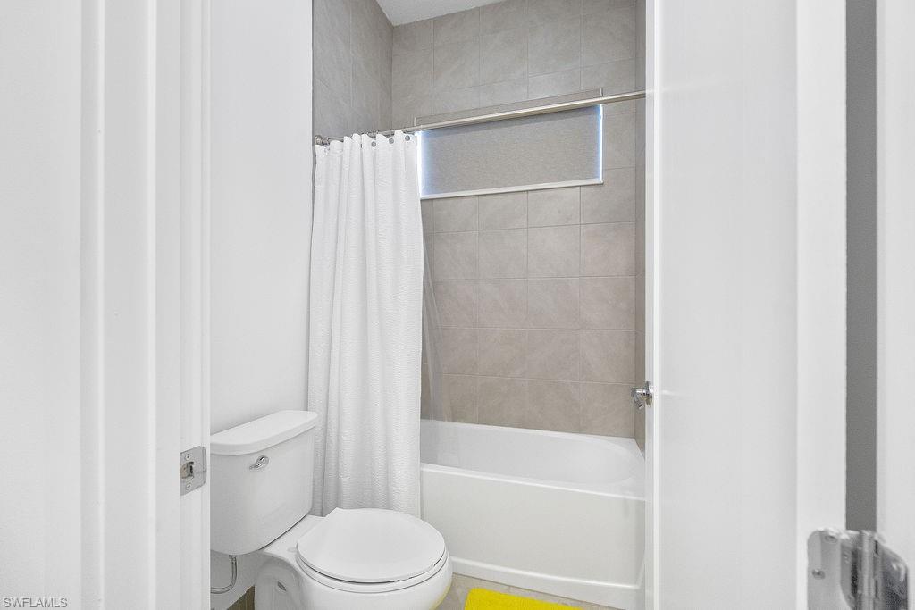 5293 Marano Drive Ave Maria, FL 34142 - Photo 14 of 23 a bathroom with a toilet and a bathtub