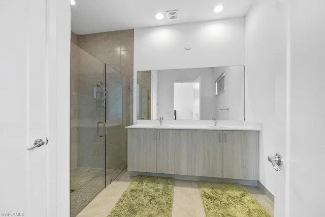 a bathroom with a sink and shower