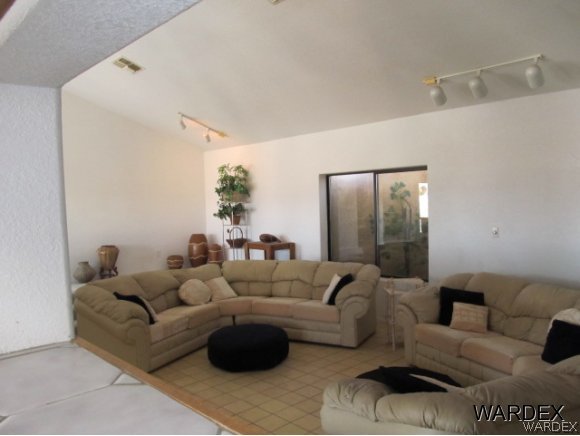 1870 Dunlap Road Fort Mohave, AZ 86426 - Photo 22 of 25 a living room with furniture and a large mirror