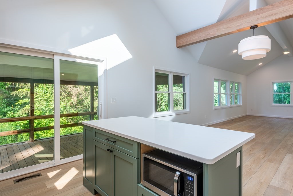 90 Memorial Drive Amherst, MA 01002 - Photo 11 of 38 a kitchen that has a stove and a table