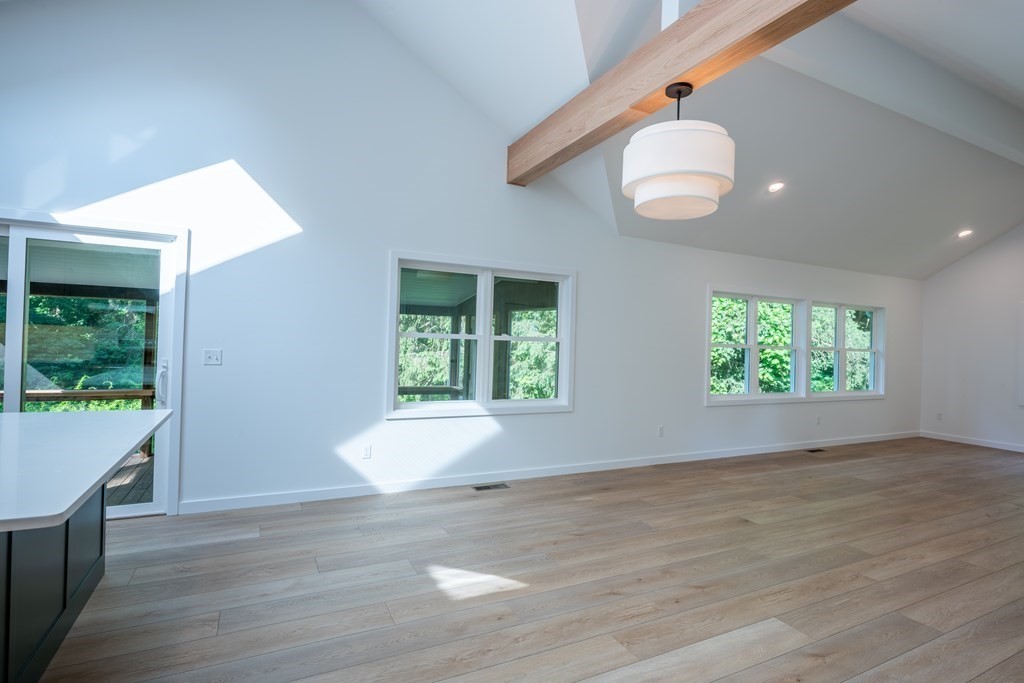 90 Memorial Drive Amherst, MA 01002 - Photo 13 of 38 an empty room with wooden floor and windows