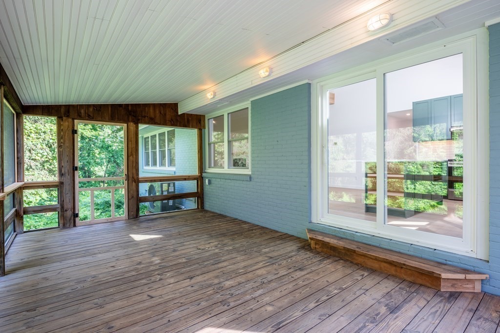 90 Memorial Drive Amherst, MA 01002 - Photo 15 of 38 a view of an empty room with wooden floor and a window