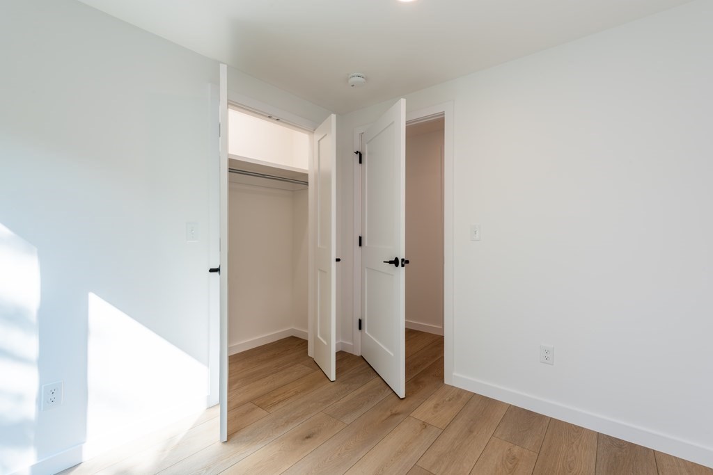 90 Memorial Drive Amherst, MA 01002 - Photo 18 of 38 a view of an empty room with wooden floor