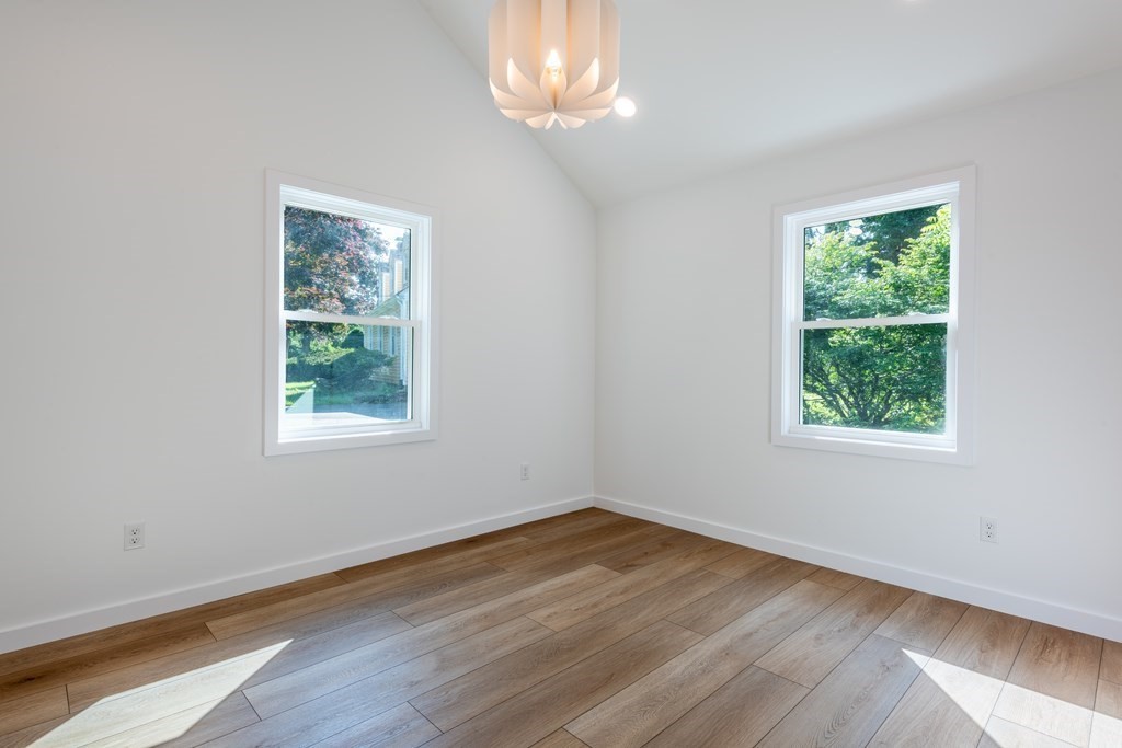 90 Memorial Drive Amherst, MA 01002 - Photo 21 of 38 wooden floor in an empty room with a window