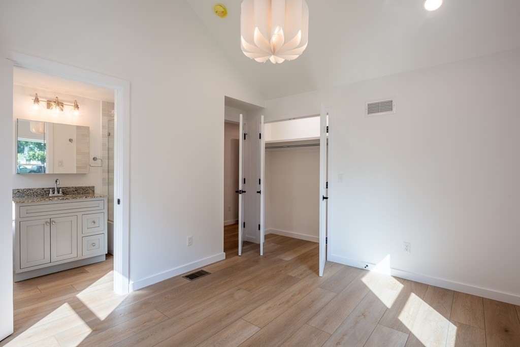 90 Memorial Drive Amherst, MA 01002 - Photo 22 of 38 wooden floor in an empty room with a window