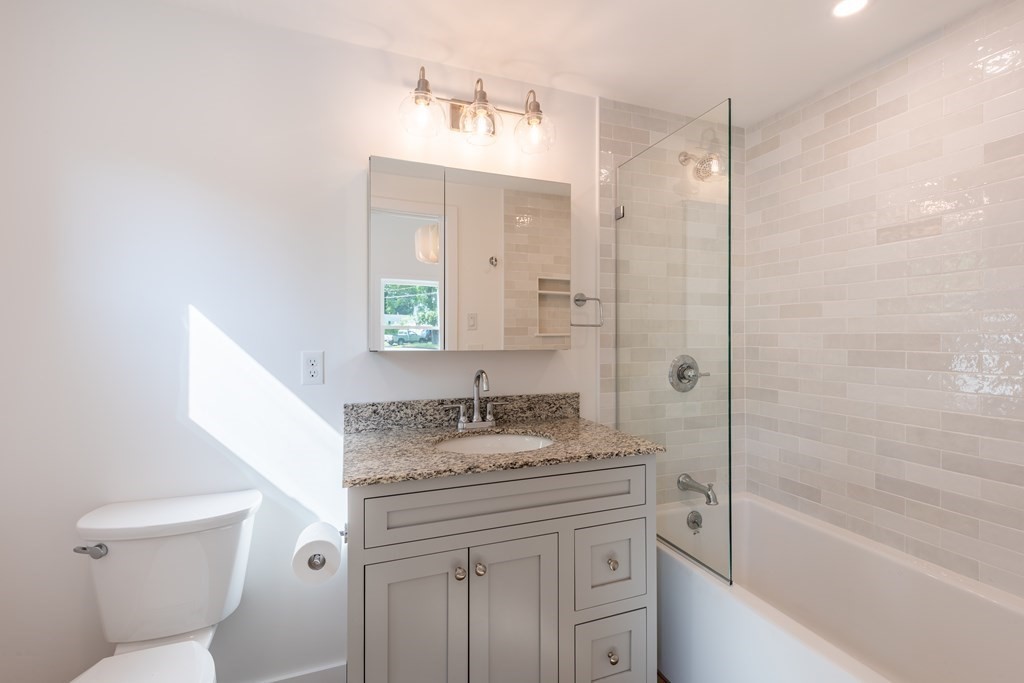 90 Memorial Drive Amherst, MA 01002 - Photo 23 of 38 a bathroom with a granite countertop sink toilet and shower