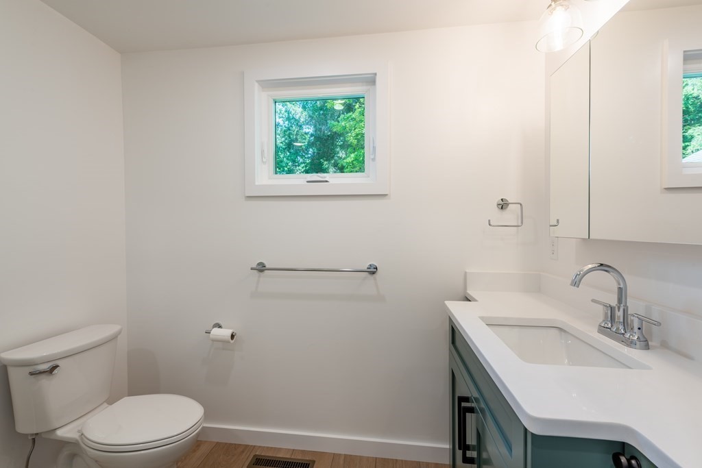 90 Memorial Drive Amherst, MA 01002 - Photo 24 of 38 a bathroom with a sink a toilet and a window