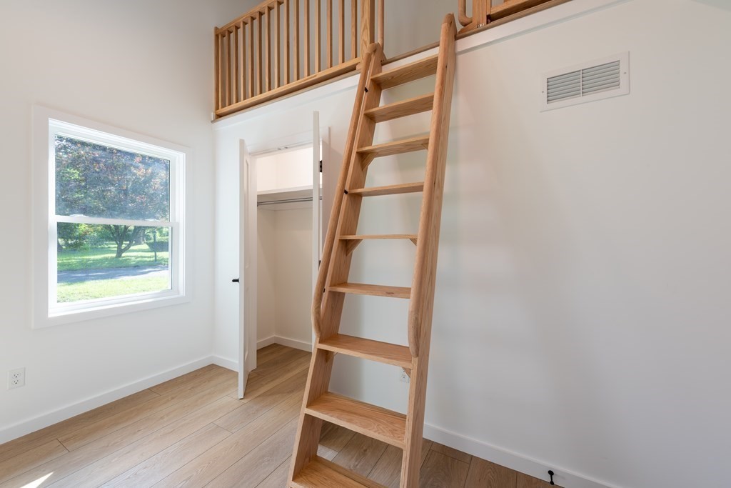 90 Memorial Drive Amherst, MA 01002 - Photo 27 of 38 a view of an empty room with wooden floor and window