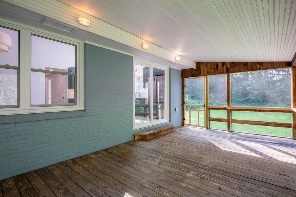 90 Memorial Drive Amherst, MA 01002 - Photo 30 of 38 a view of an empty room with a window and wooden floor