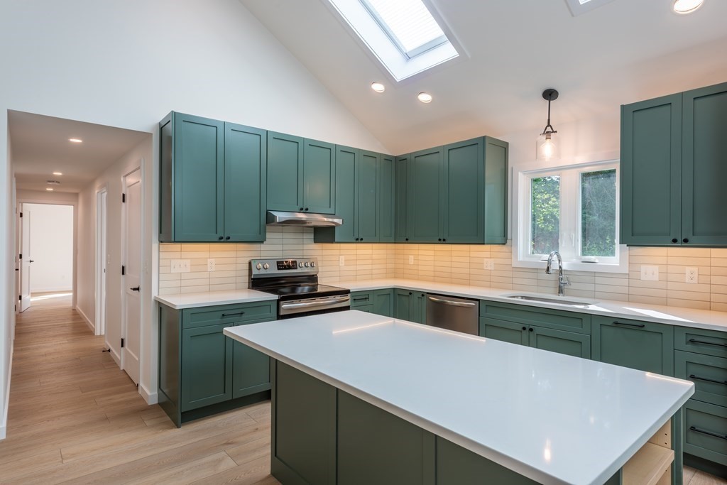 90 Memorial Drive Amherst, MA 01002 - Photo 9 of 38 a kitchen with a sink and a refrigerator