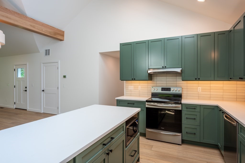 90 Memorial Drive Amherst, MA 01002 - Photo 10 of 38 a kitchen with a stove and a cabinets