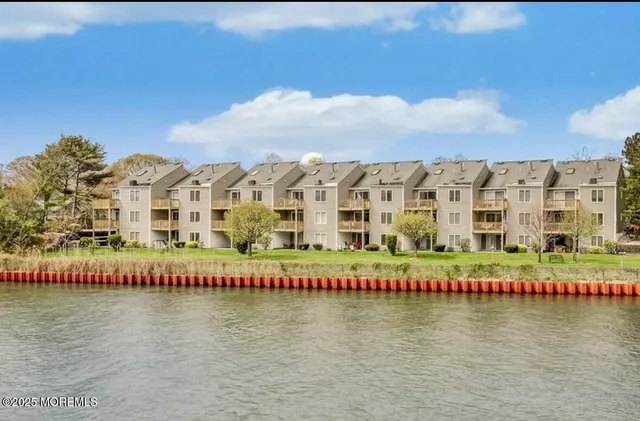 a view of a water with building in front of it