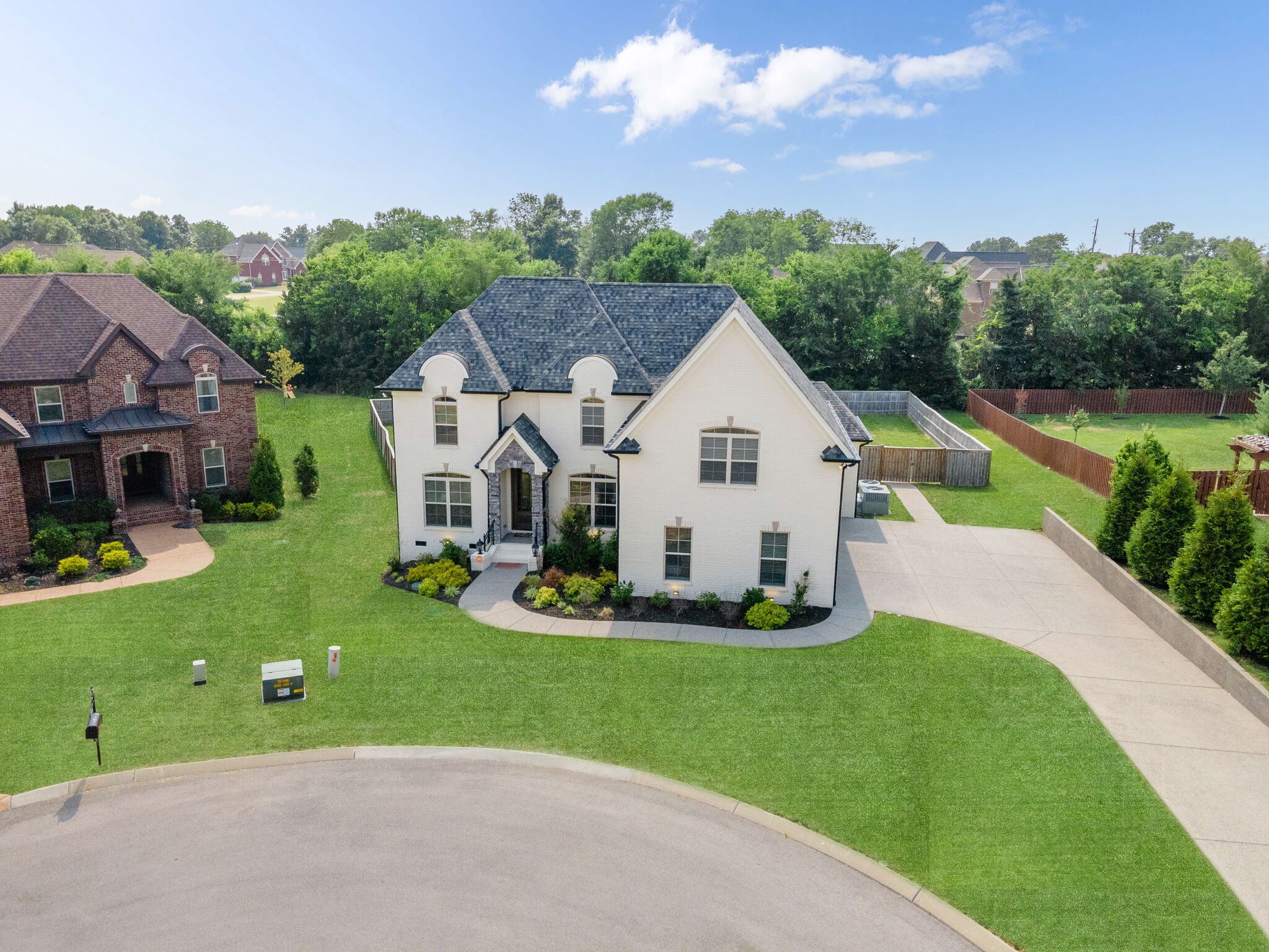2002 Beechhaven Cir Mount Mount Juliet, TN 37122 - Photo 12 of 57 a view of a white house with a big yard and potted plants