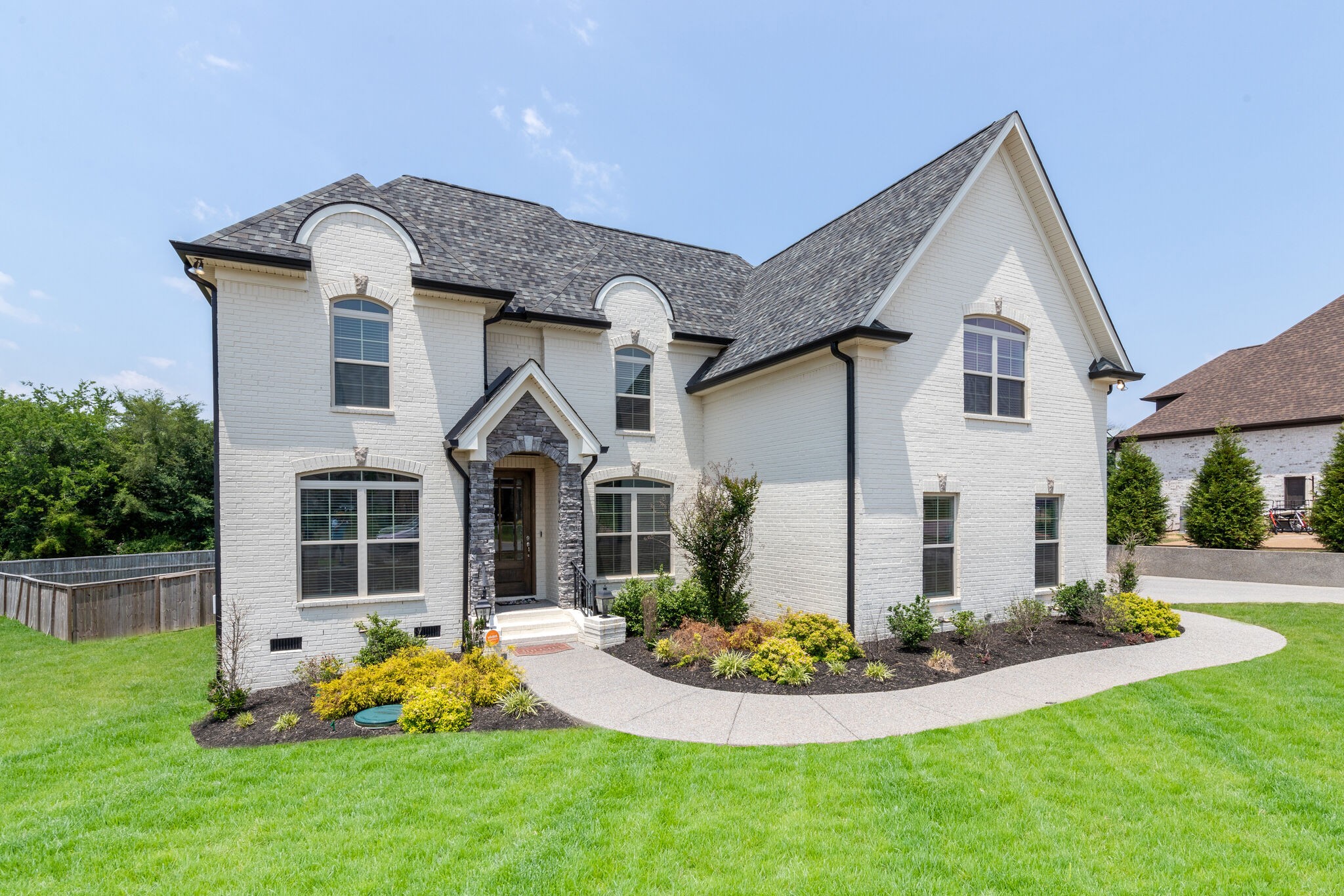 2002 Beechhaven Cir Mount Mount Juliet, TN 37122 - Photo 2 of 57 a front view of a house with a yard and porch
