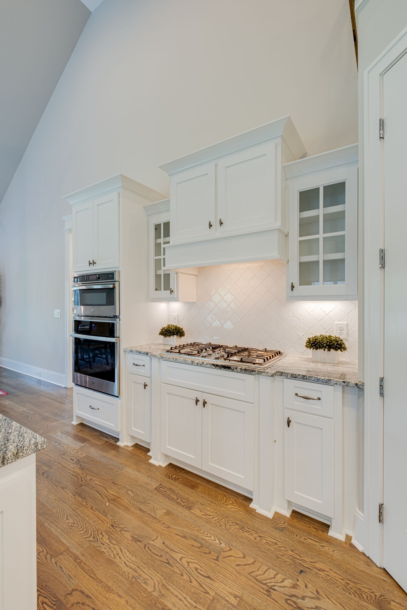 2002 Beechhaven Cir Mount Mount Juliet, TN 37122 - Photo 29 of 57 a kitchen with granite countertop a stove cabinets and wooden floor