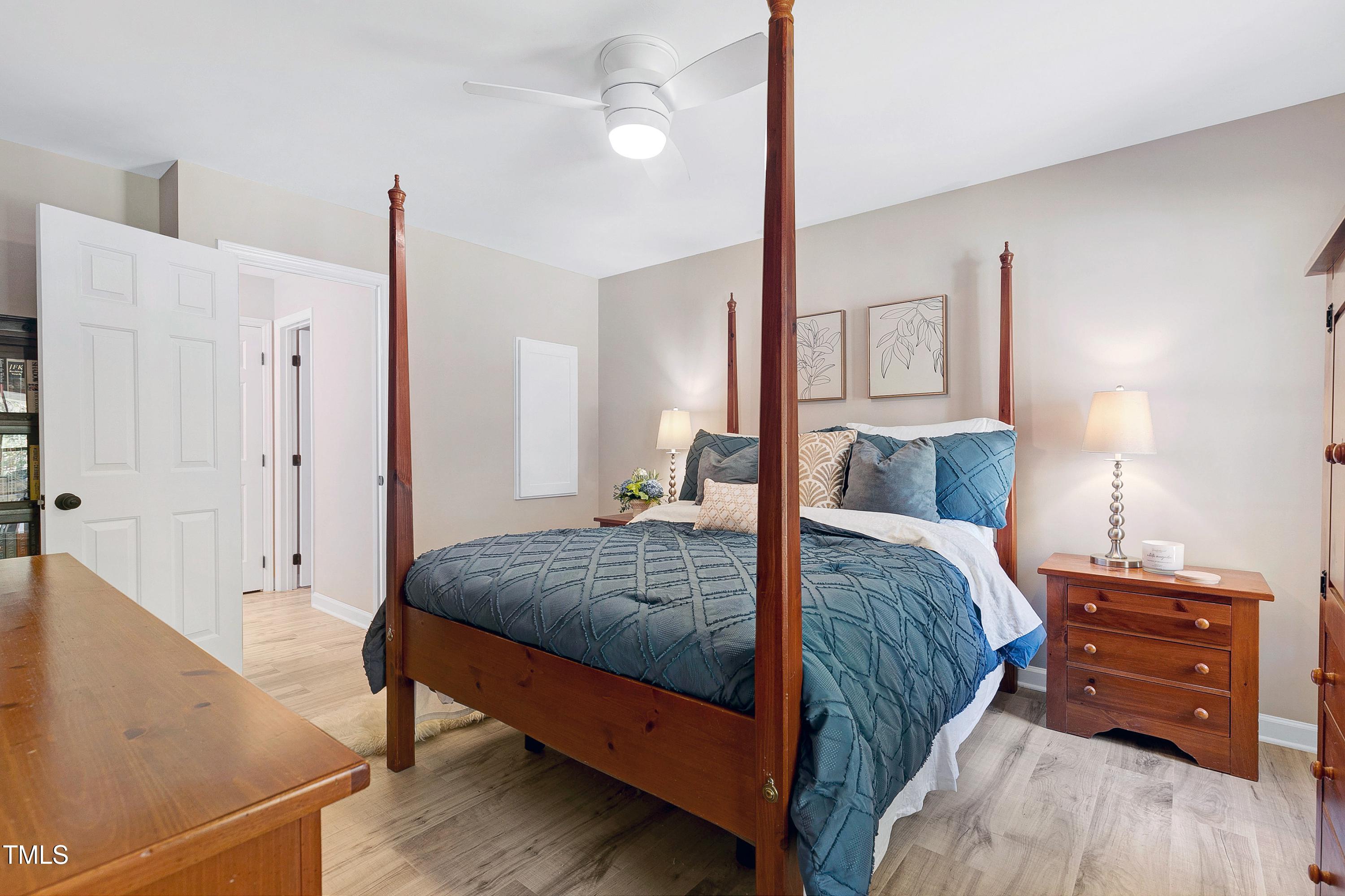 7834 James Austin Road Willow Spring, NC 27592 - Photo 15 of 46 a bedroom with a bed and a dresser