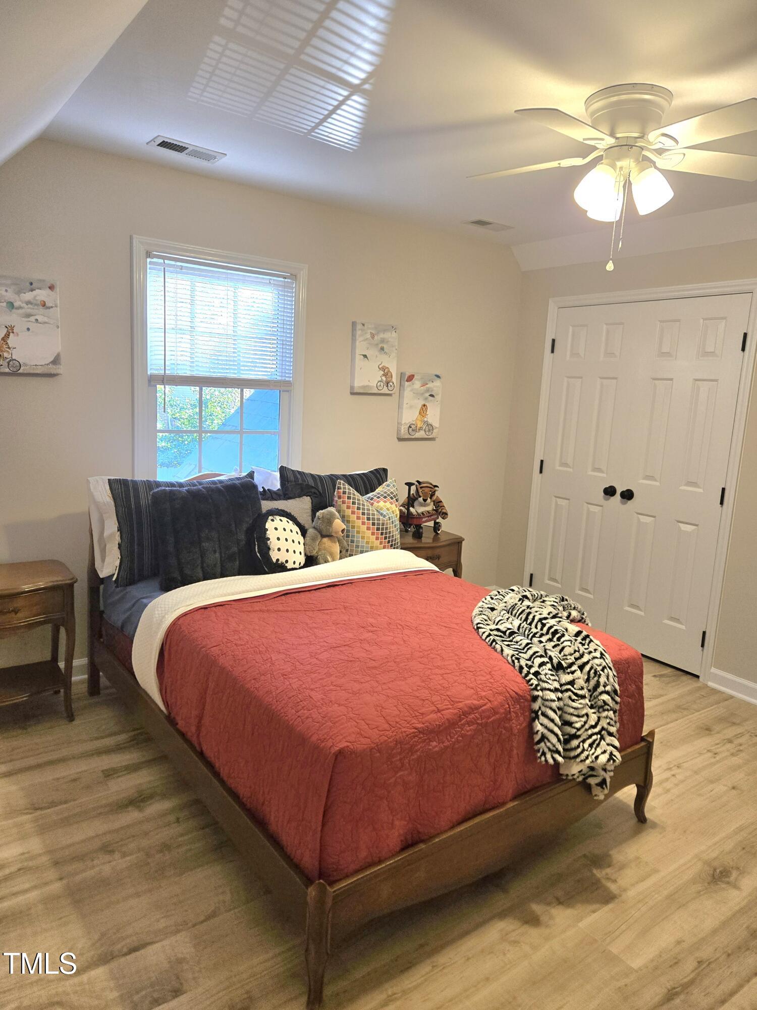 7834 James Austin Road Willow Spring, NC 27592 - Photo 27 of 46 a bedroom with a bed and window