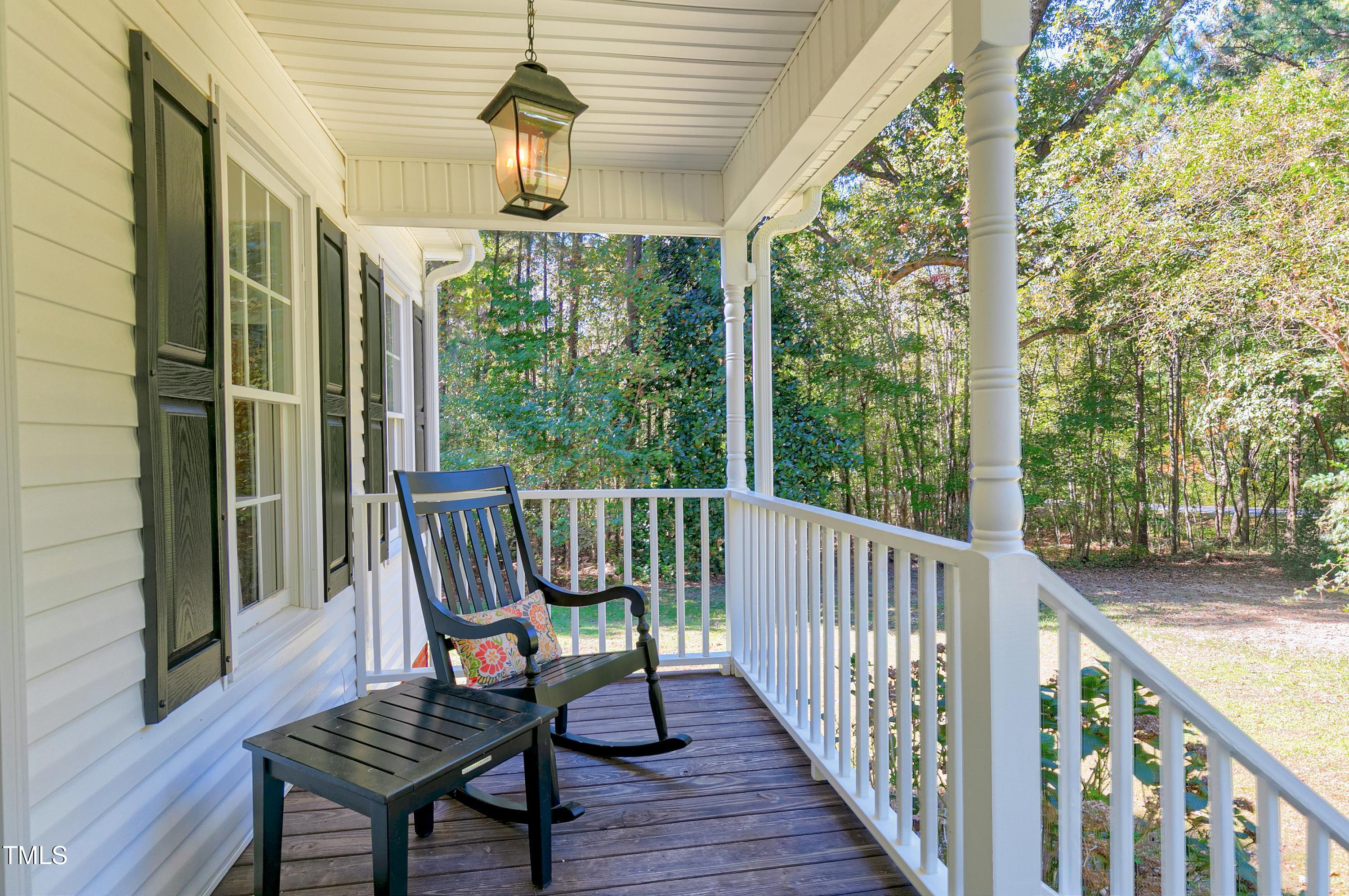 7834 James Austin Road Willow Spring, NC 27592 - Photo 3 of 46 a view of a chairs in balcony