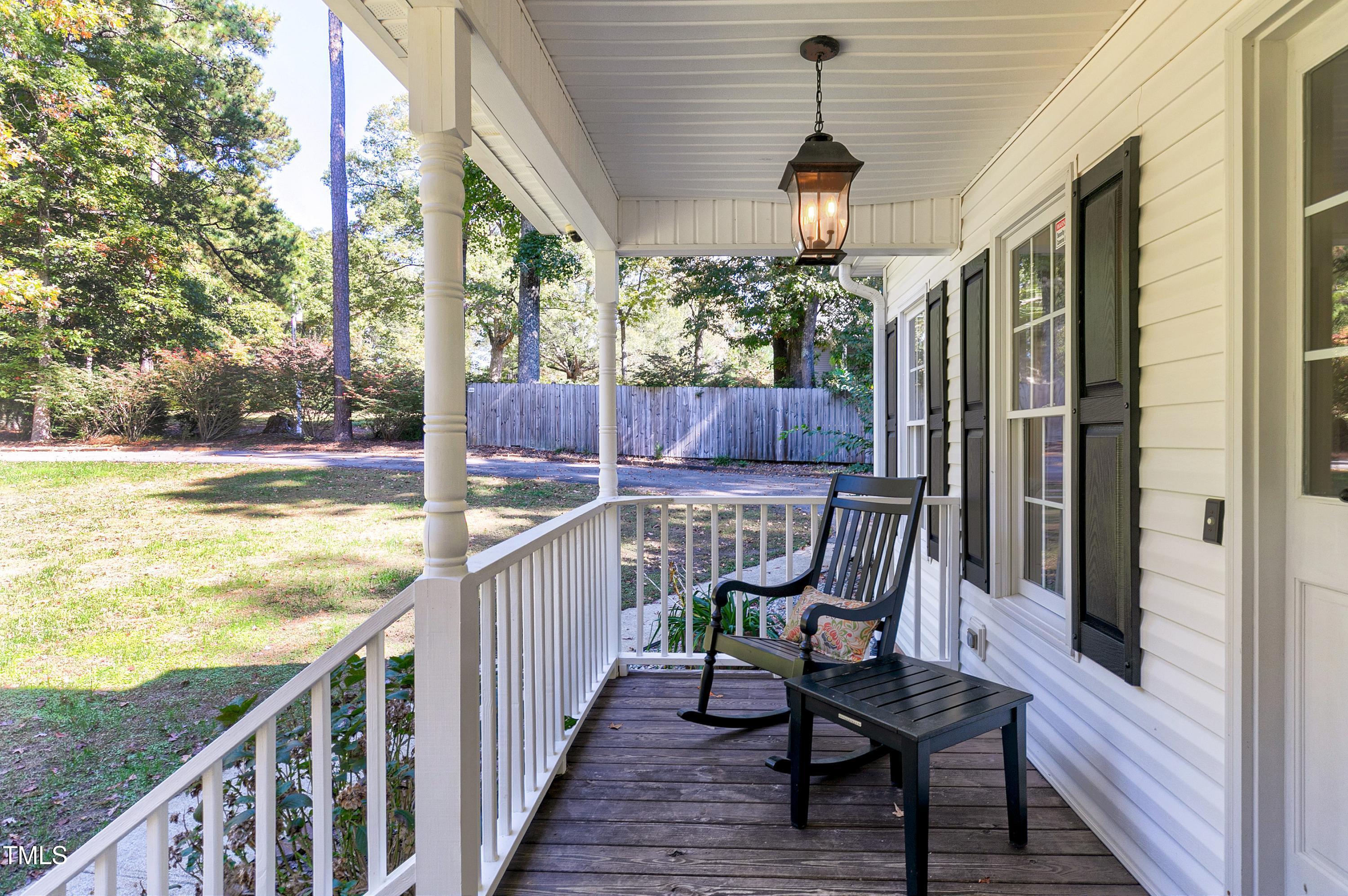 7834 James Austin Road Willow Spring, NC 27592 - Photo 4 of 46 a view of a balcony with chairs