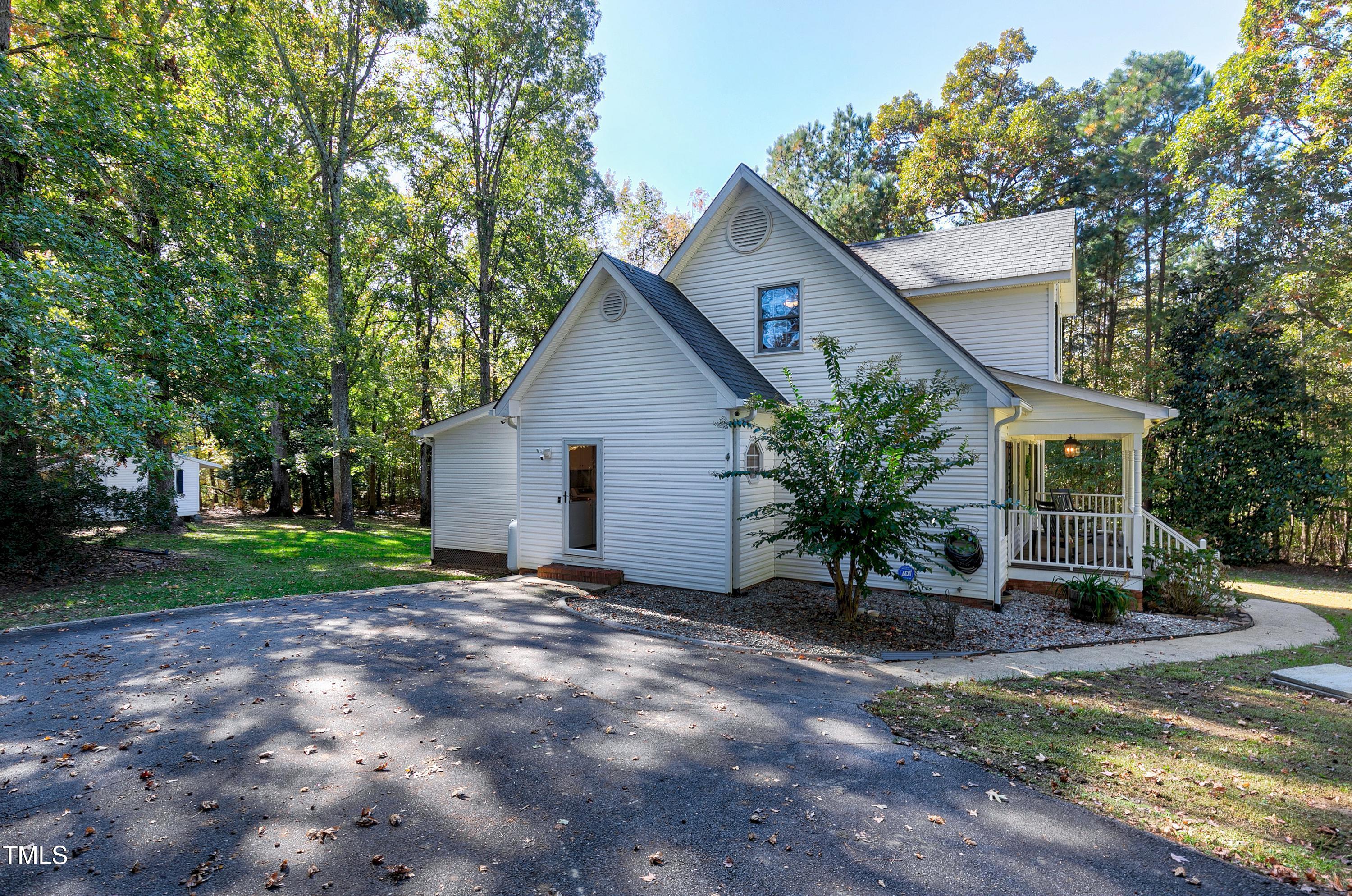 7834 James Austin Road Willow Spring, NC 27592 - Photo 41 of 46 a view of a house with backyard and a tree