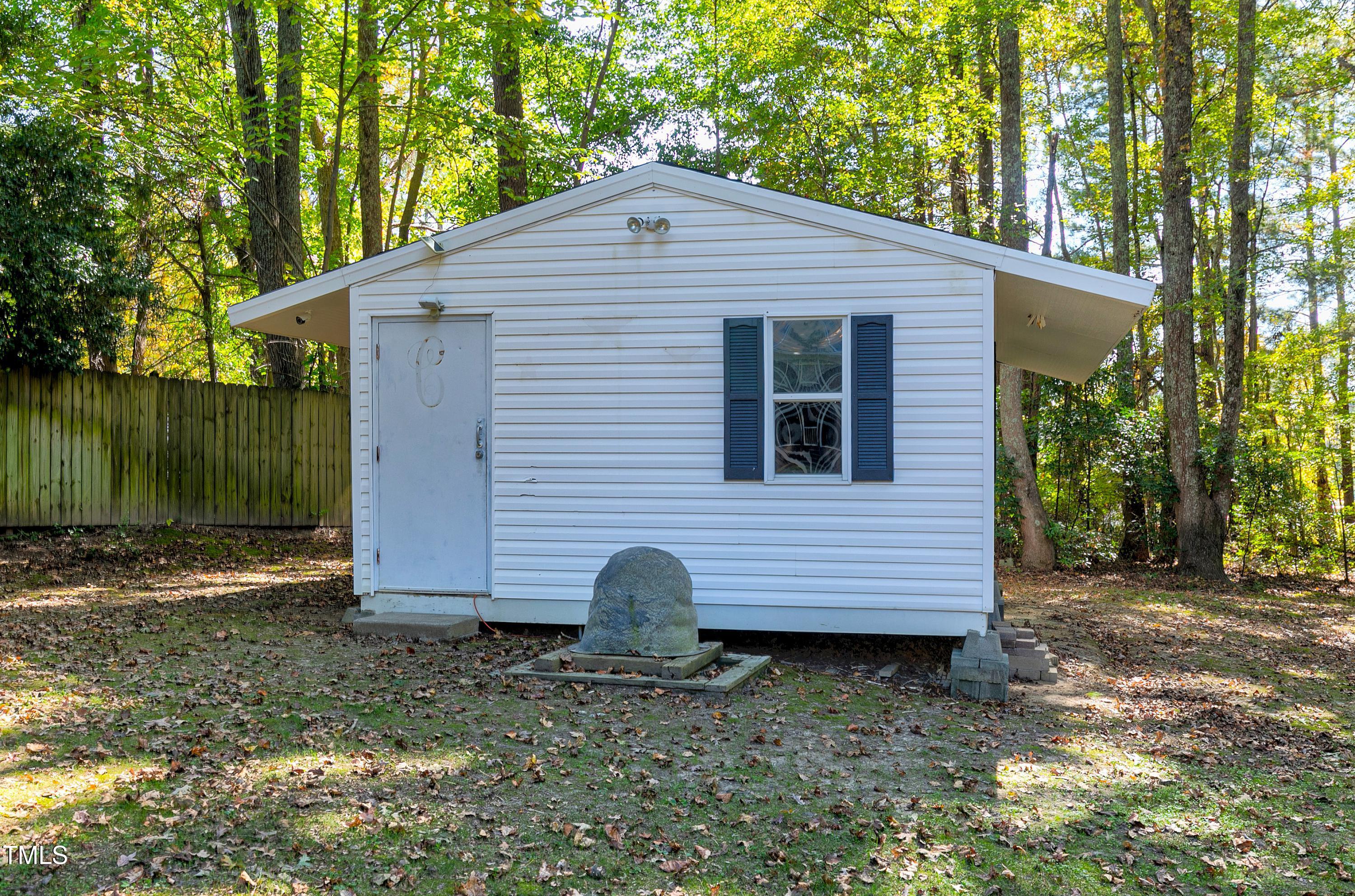 7834 James Austin Road Willow Spring, NC 27592 - Photo 46 of 46 a view of a small house and yard