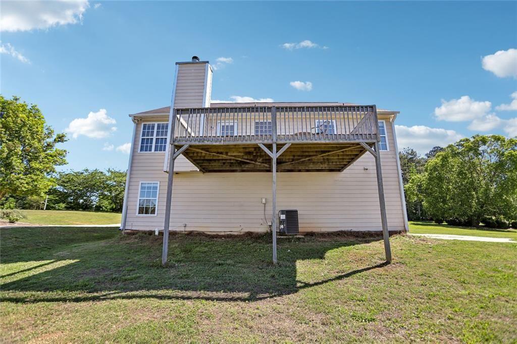 9720 Poole Road Villa Rica, GA 30180 - Photo 33 of 40 a front view of a house with garden