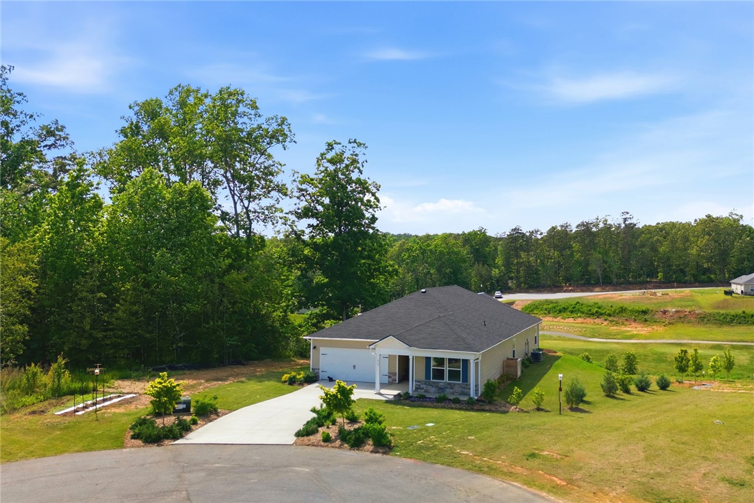 412 Chadwick Lane Walhalla, SC 29691 - Photo 4 of 37 Perched on a verdant lot, this single-story residence boasts a practical attached garage and well-maintained grounds.