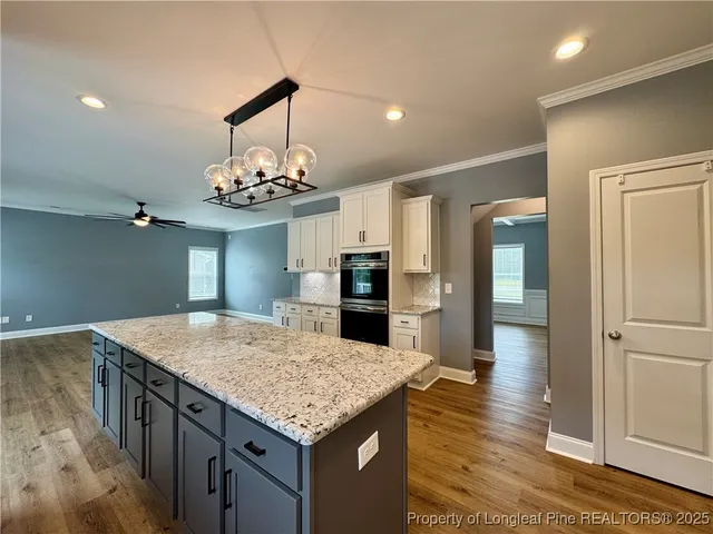 a kitchen with a table and refrigerator