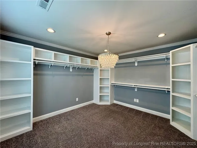 a view of a room with a ceiling fan