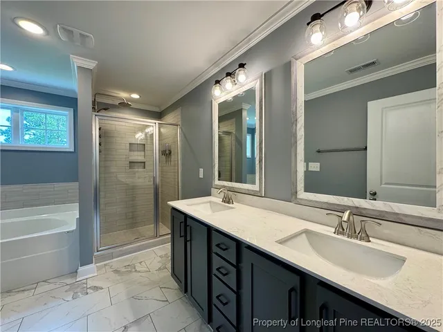 a bathroom with a sink double vanity and a shower