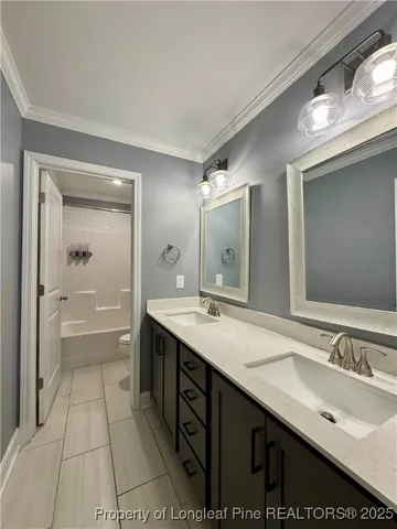 a spacious bathroom with a granite countertop sink mirror and a bathtub