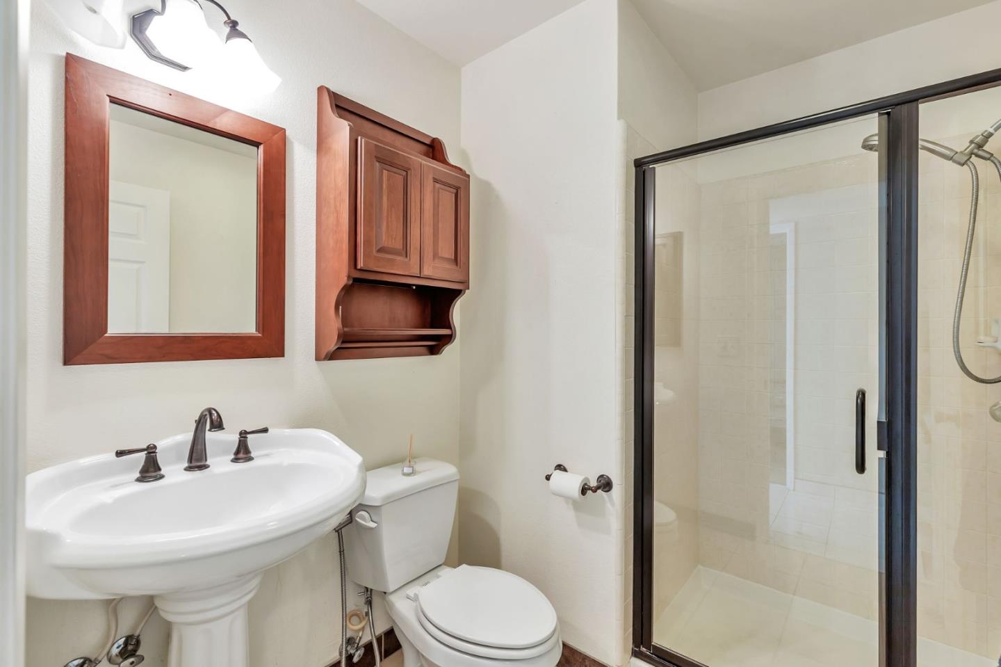 1206 Sycamore Court Gilroy, CA 95020 - Photo 9 of 44 a bathroom with a sink a toilet and shower