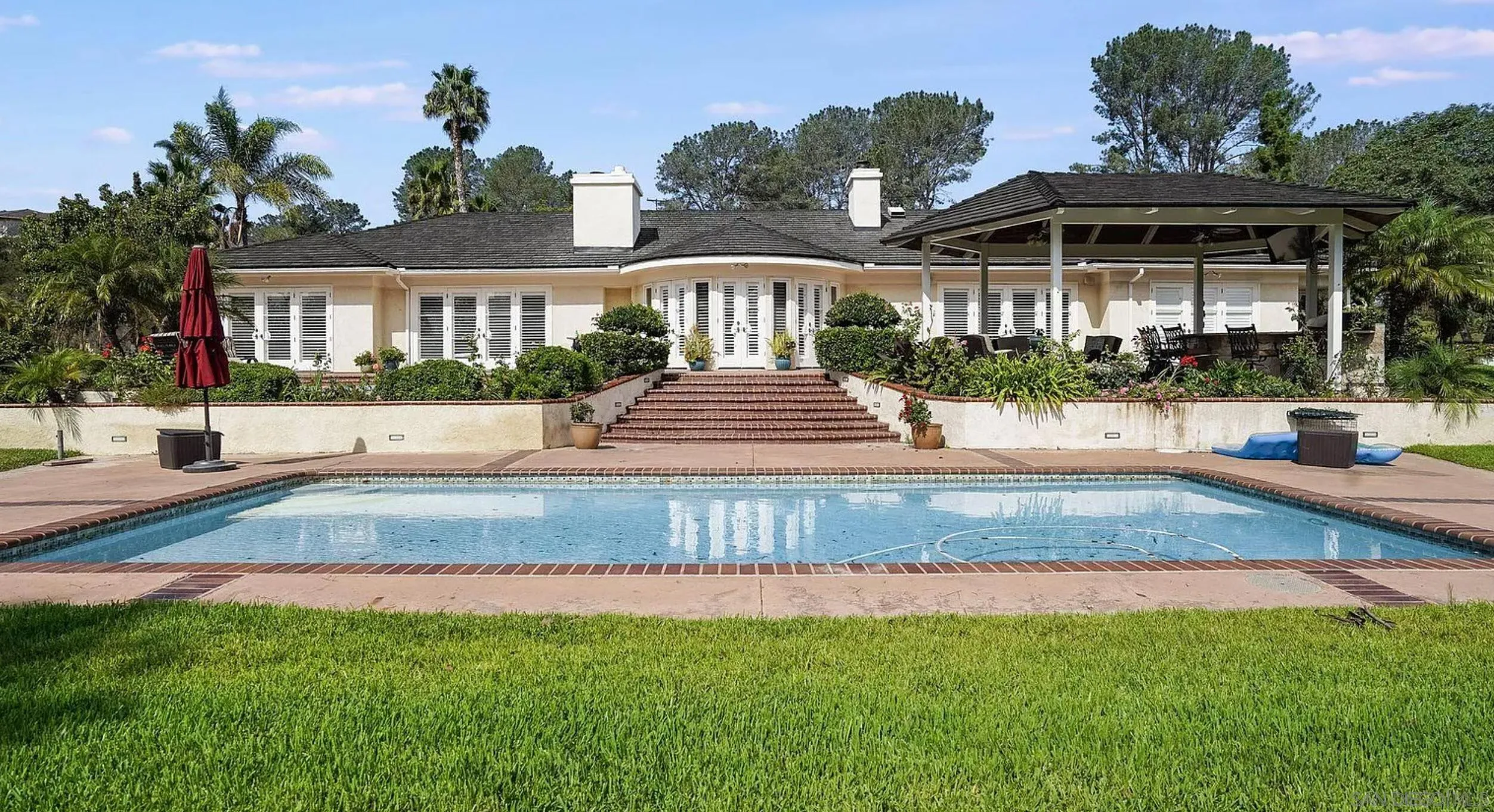 4701 El Mirar Rancho Santa Fe, CA 92067 - Photo 2 of 9 a view of a house with a yard