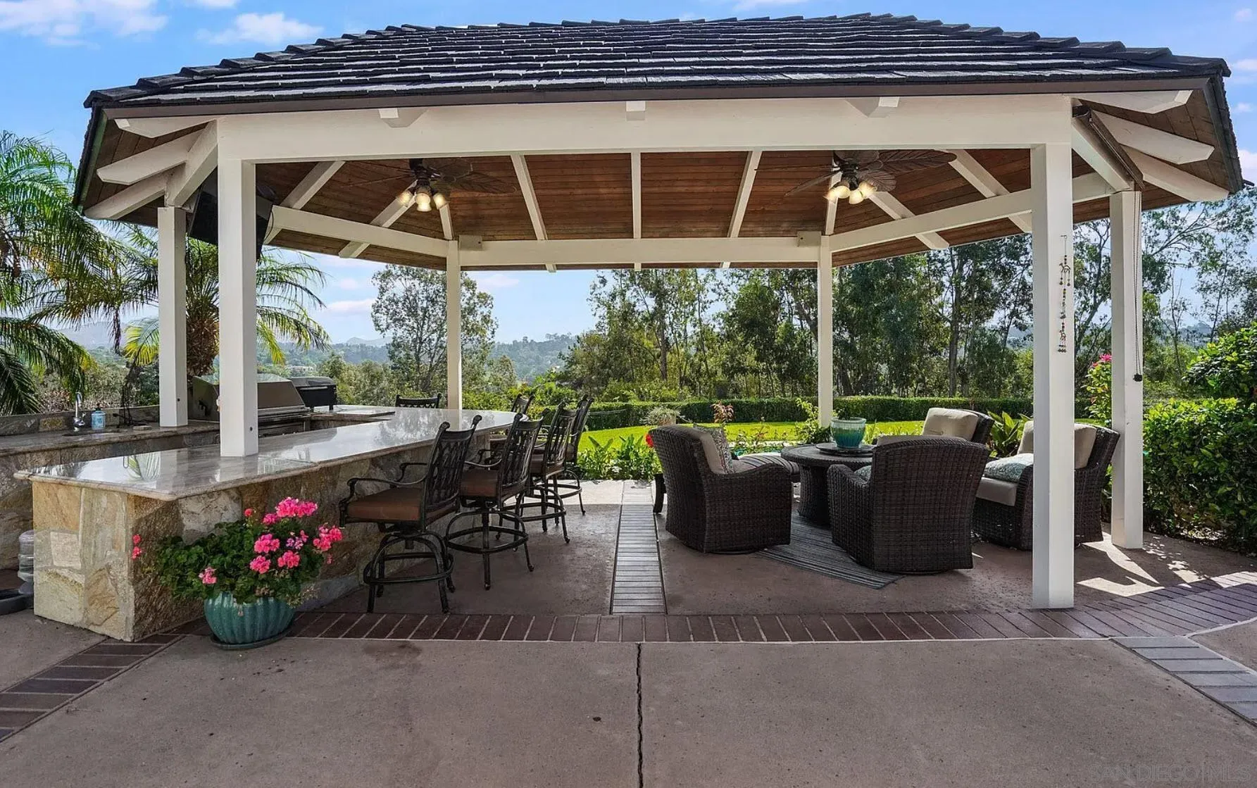 4701 El Mirar Rancho Santa Fe, CA 92067 - Photo 8 of 9 a view of a patio with table and chairs potted plants with floor to ceiling window and potted plants