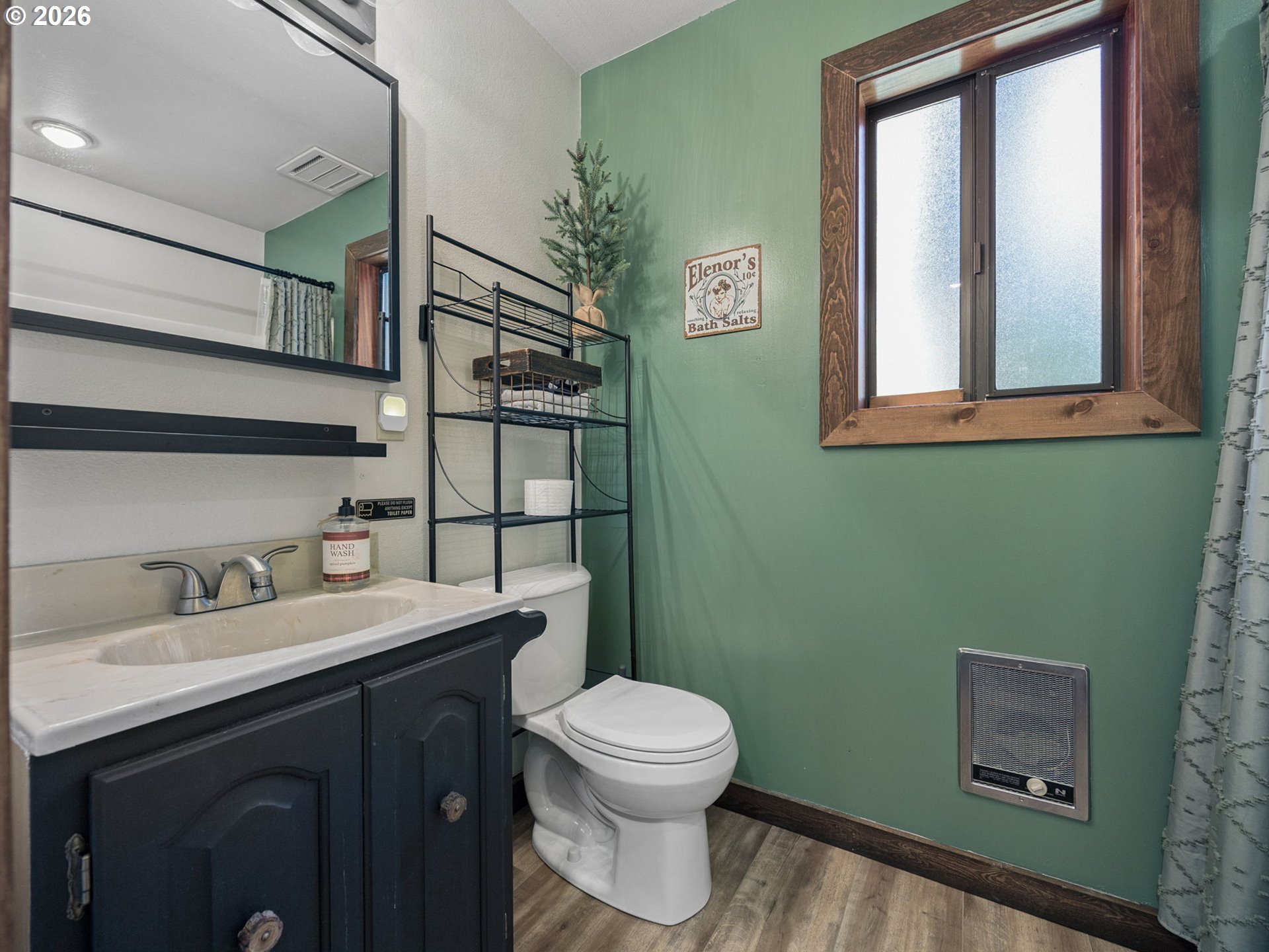 65582 East Timberline Drive Rhododendron, OR 97049 - Photo 12 of 47 a bathroom with a toilet a sink and mirror