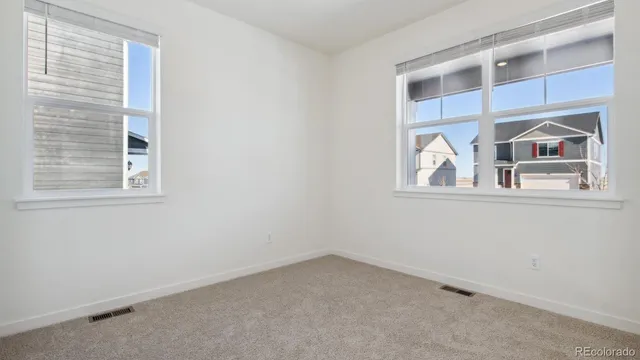 a view of empty room with windows