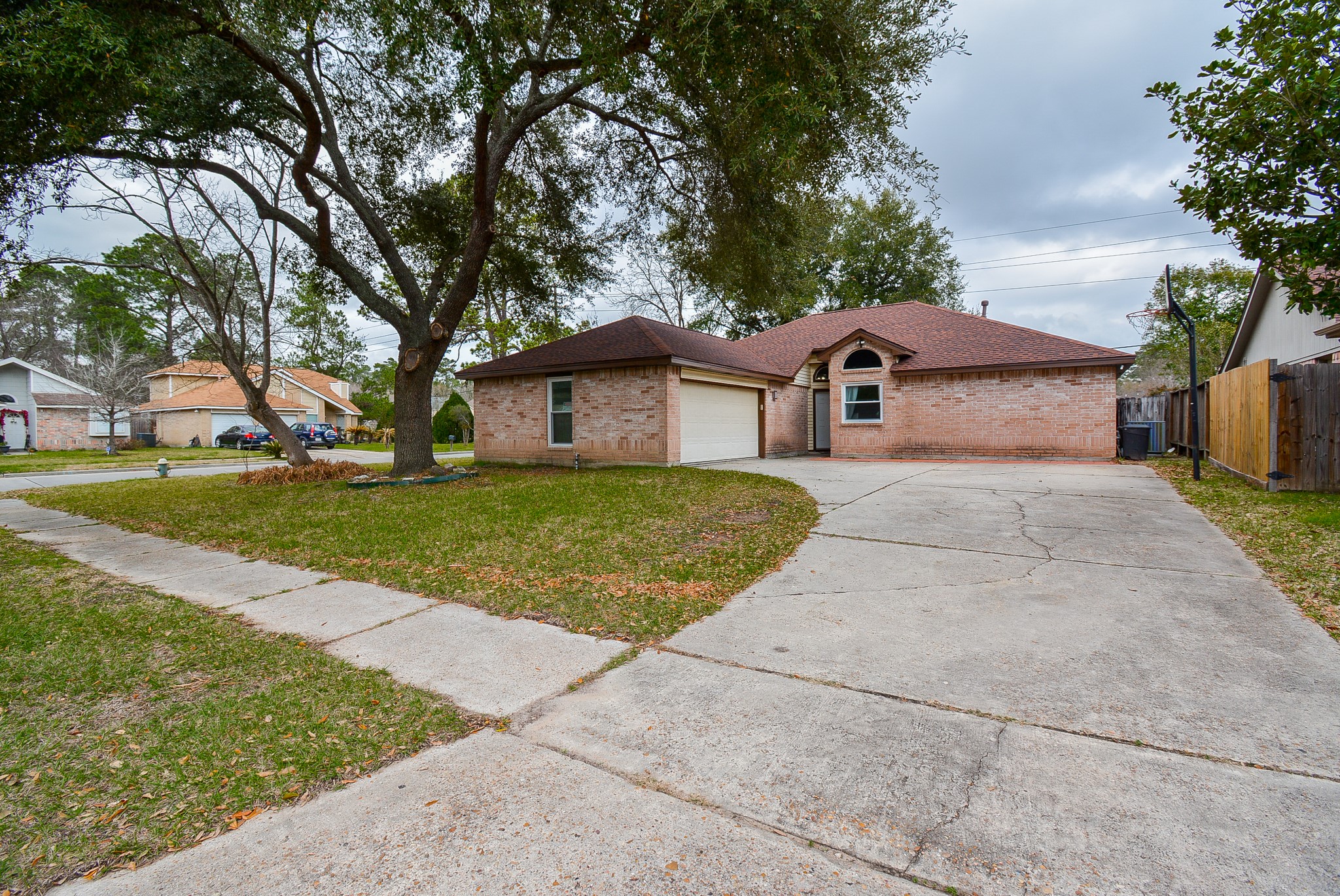 23734 Canyon Lake Drive Spring, TX 77373 - Photo 1 of 32 a front view of a house with a yard and garage