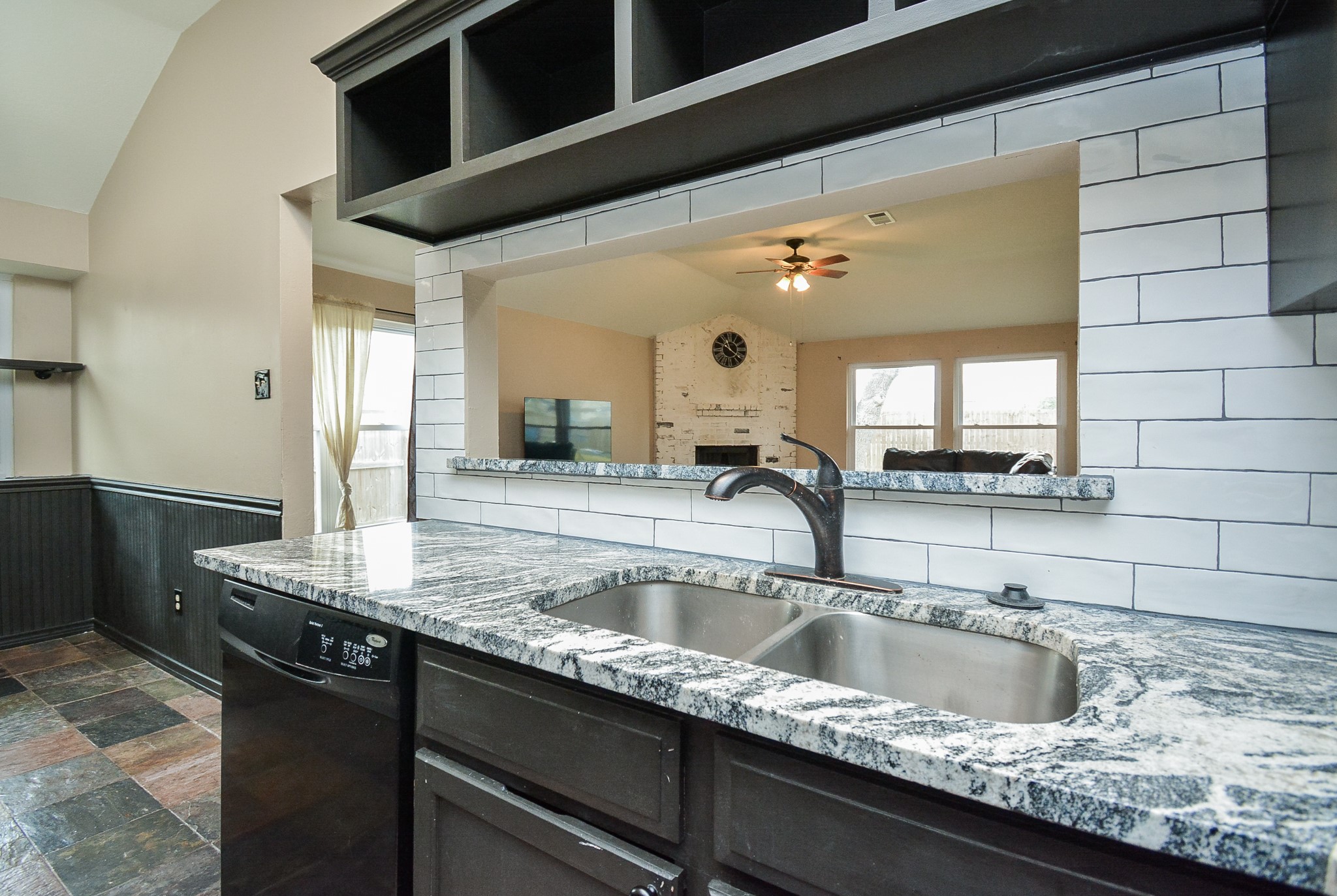 23734 Canyon Lake Drive Spring, TX 77373 - Photo 11 of 32 a kitchen with granite countertop a sink and a wooden cabinets